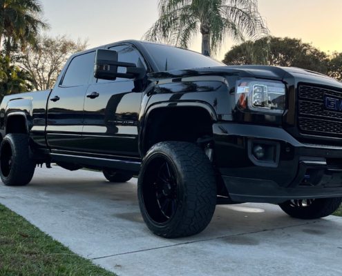 Black GMC Truck Black GMC truck with a deep, mirror-like shine after professional detailing in Palm Beach County.