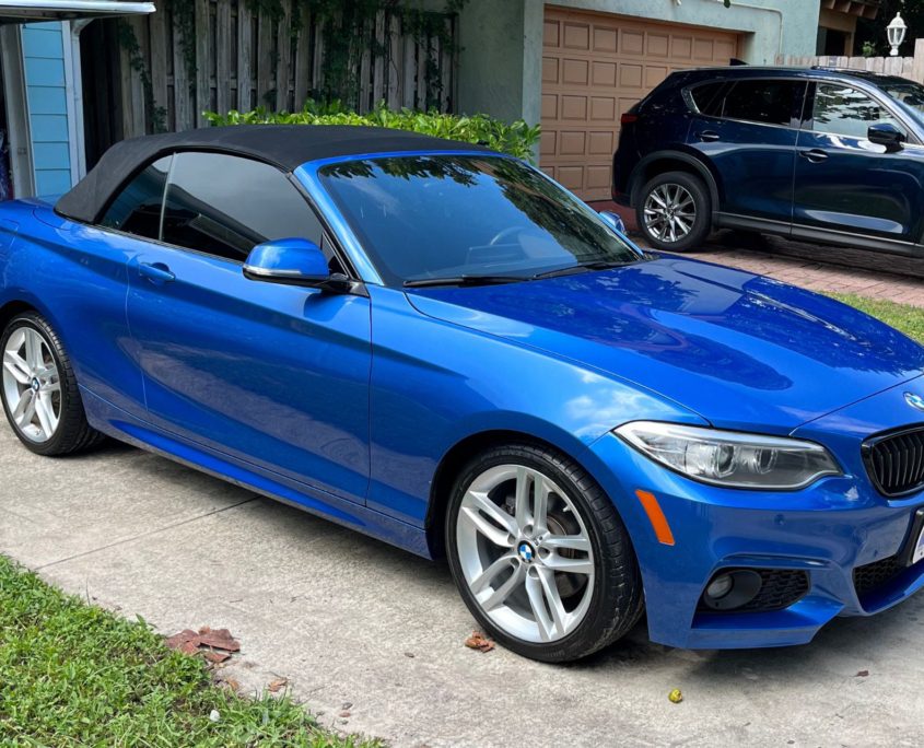 Blue BMW Blue BMW with a sleek, reflective finish after professional auto detailing in Palm Beach County.