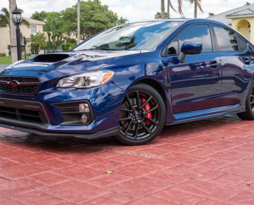 Blue Subaru Blue Subaru with a clean, glossy exterior after professional auto detailing in Palm Beach County.