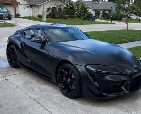Black Toyota Supra Black Toyota Supra with a deep matte finish after professional detailing in Palm Beach County.