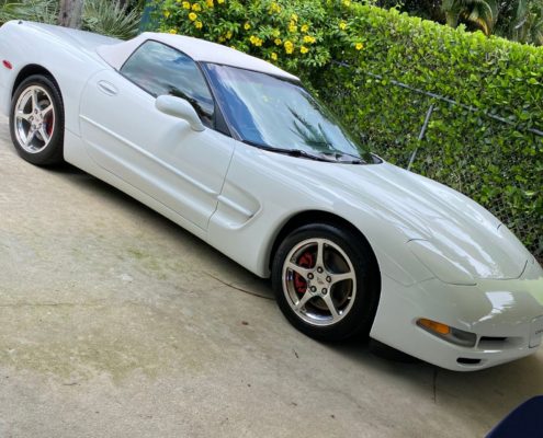 White Corvette White Corvette with a high-gloss reflective finish after professional detailing in Palm Beach County.